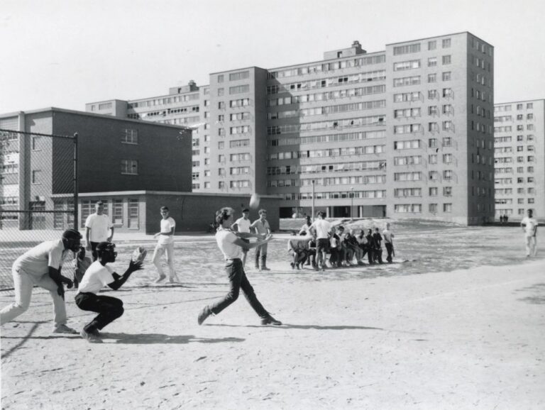 Kids play baseball in front of the Pruitt-Igoe Housing Project in St. Louis, MO. Date unknown.