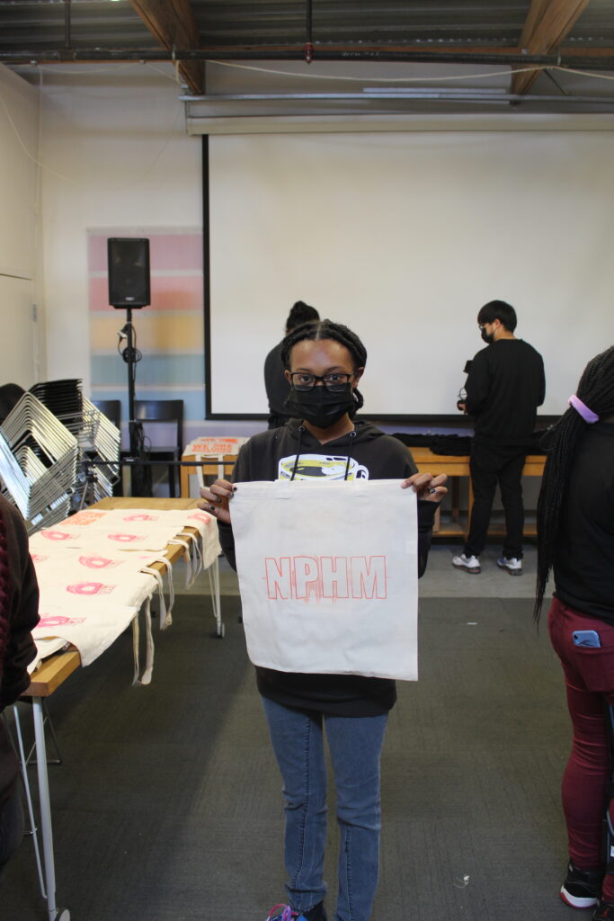 Image of people holding posters