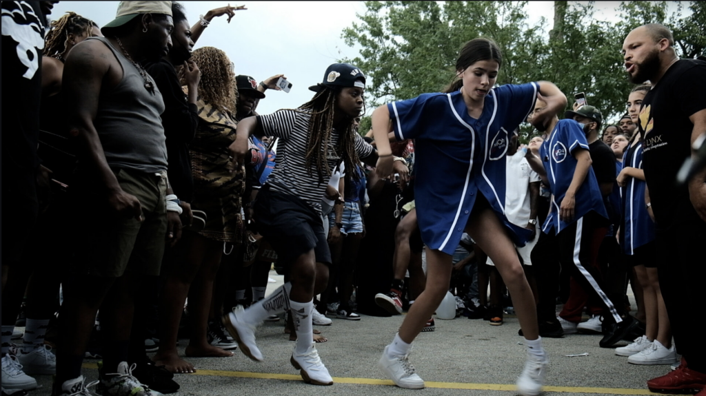 Still from _Footwork Saved My Life Film_, courtesy of ShaDawn Battle and Kameron Davis_Havoc Picnic Girl in Blue Jersey