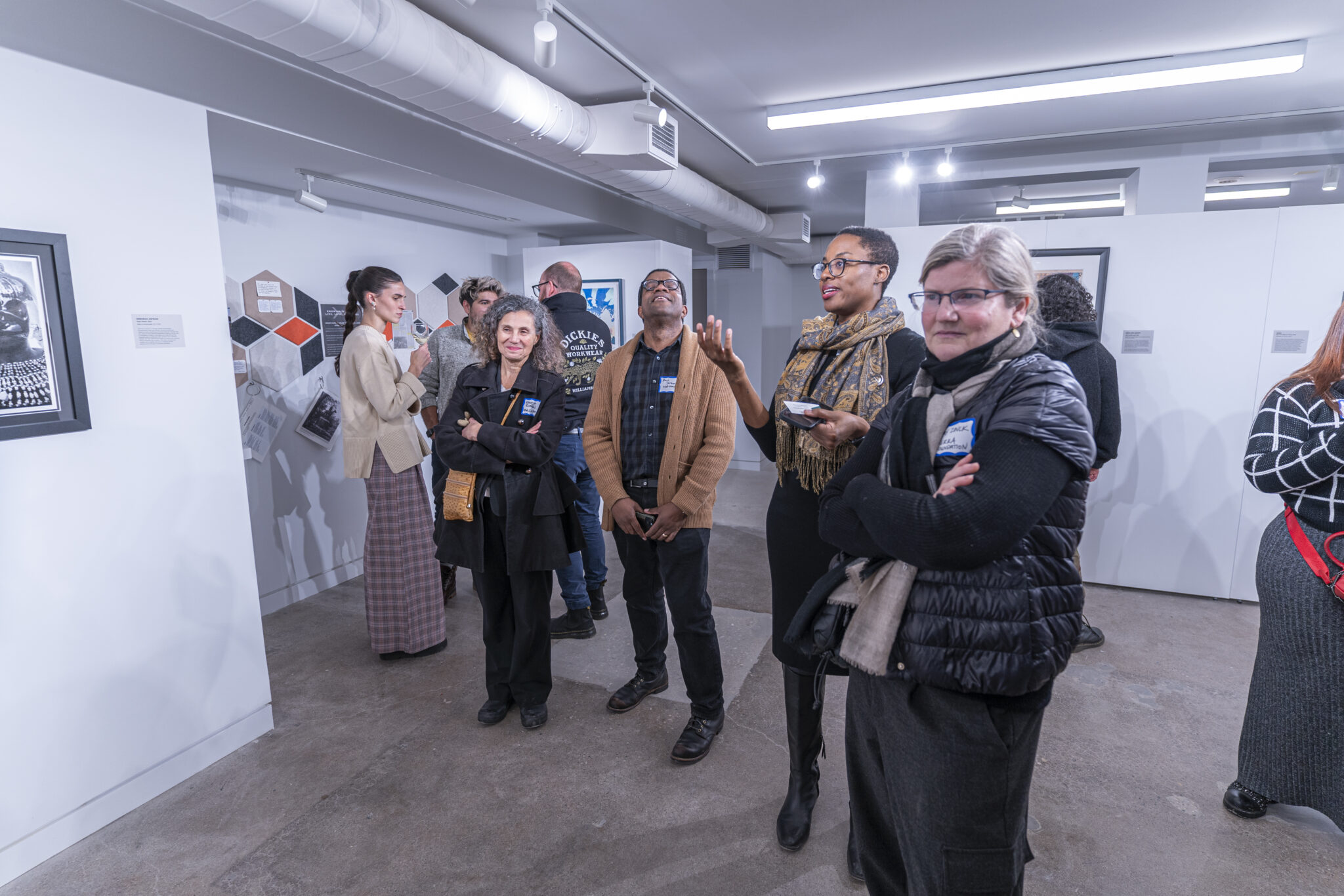 A group of people in an art exhibition