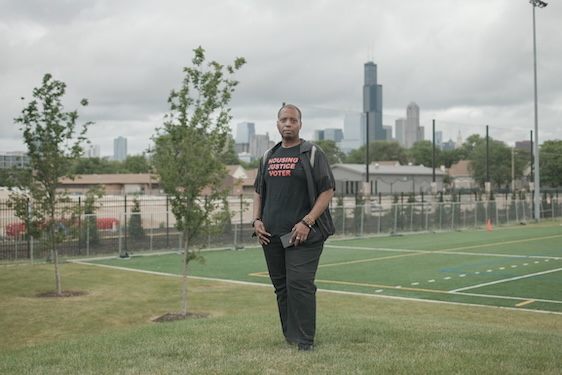 Film still of Don Washington in a shirt that reads Housing Justice Voter