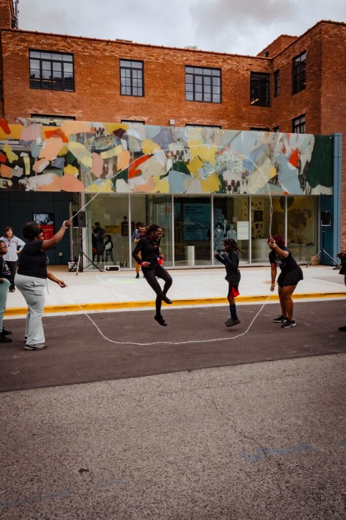 On the street playing double dutch