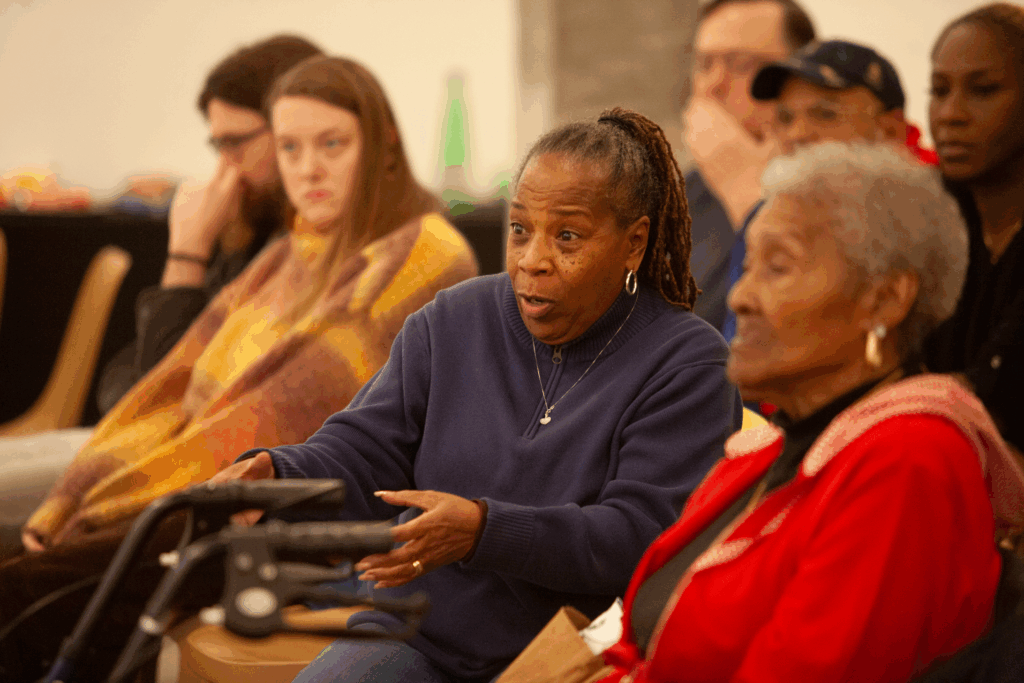 Audience members ask questions during a film screening
