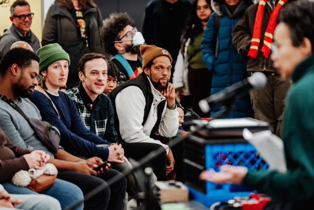 A crowd listens during a program