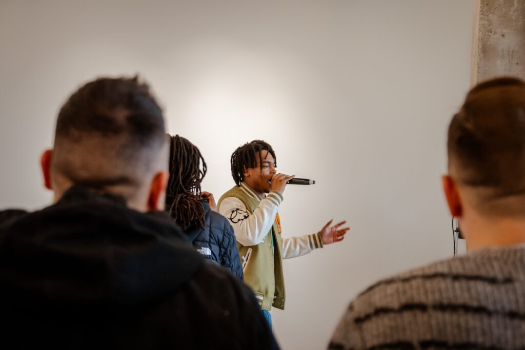 Zion Ali performing in front of a crowd