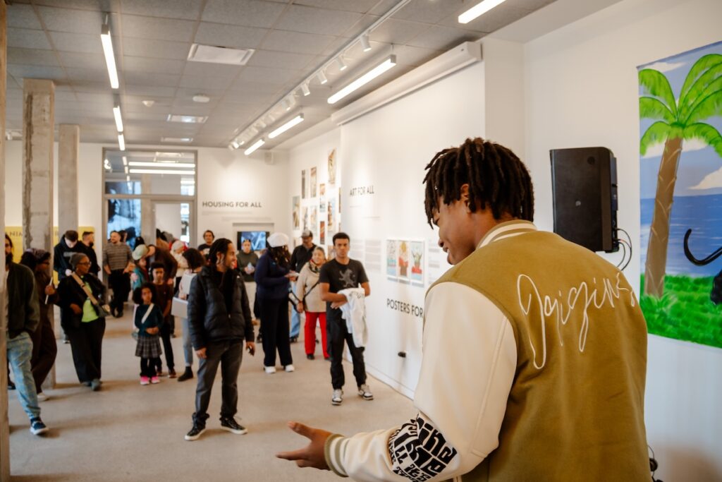 Zion Ali performing in the Living Room at the National Public Housing Museum