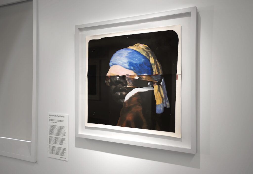 Portrait hanging in a gallery, with a placard that reads Erica with the Pearl Earring
