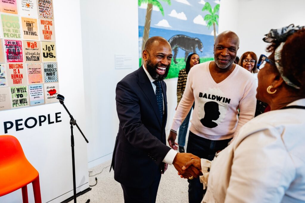 Artist Nathaniel Mary Quinn greets visitors at the museum