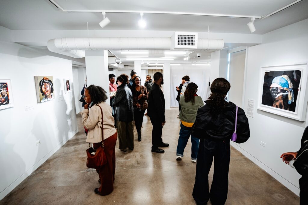 A packed gallery during an art opening