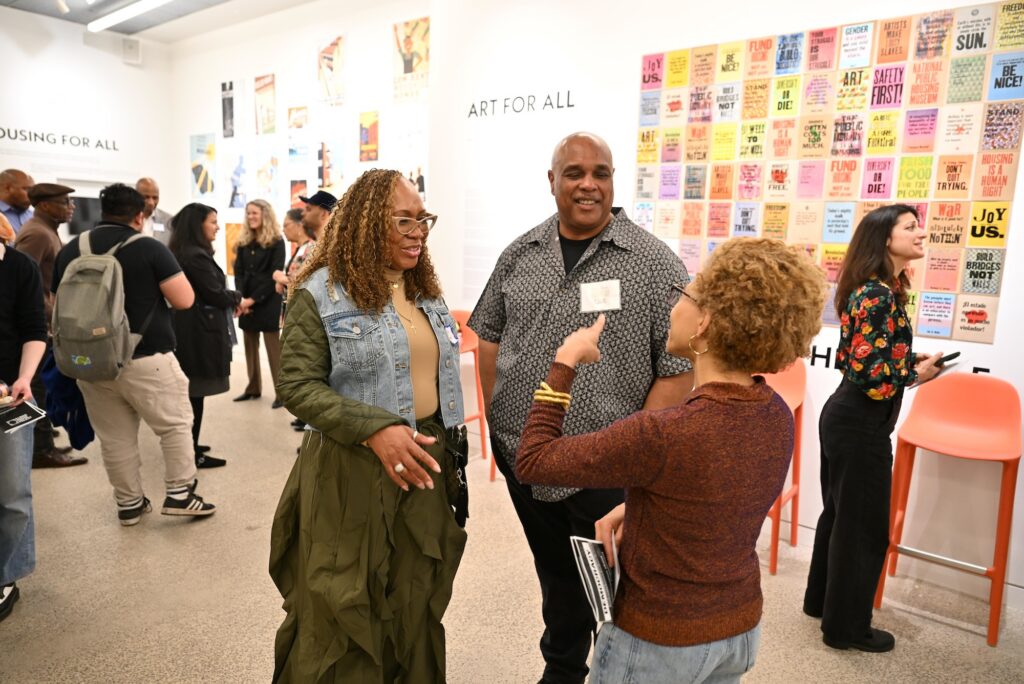 People socializing in the museum's Living Room