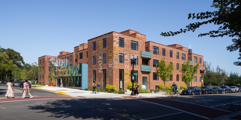 View of the 3-story National Public Housing Museum from across the street