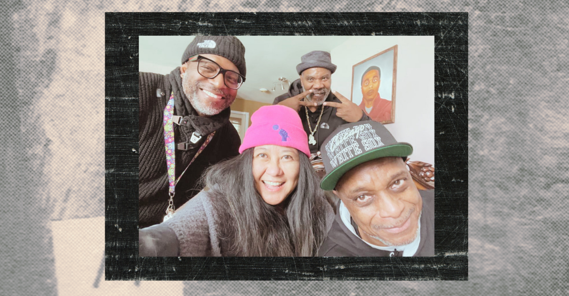 A group selfie set against a gray and black frame